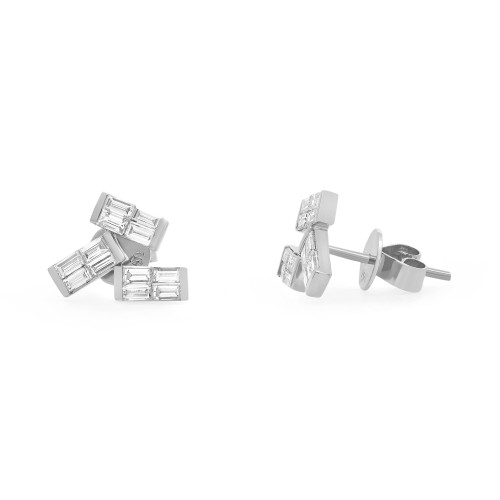 An image of a pair of Rachel Koen brand earrings for women, featuring baguette cut diamonds in white gold. The earrings are displayed against a white background with one earring lying on its side facing left and angled slightly towards the camera, while the other is upright with the post parallel to the camera's viewpoint. Both earrings are positioned close to the center of the frame, showing intricate details and the reflective quality of the diamonds.