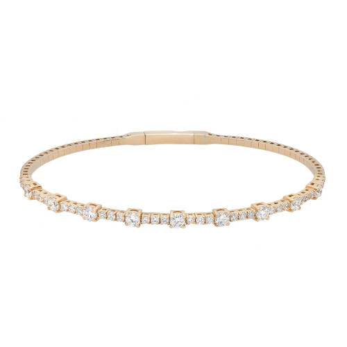 An image of a Rachel Koen women's bracelet with diamonds, shown in a close frontal view against a white background. The bracelet is positioned horizontally across the frame, with the clasp slightly off-center to the right. The piece features a series of sparkling round cut diamonds set in a yellow gold bracelet, capturing light at various angles to highlight the stones' brilliance. The photograph is taken from a distance that allows the entire bracelet to be in focus, showcasing its elegant design and luxurious appearance.