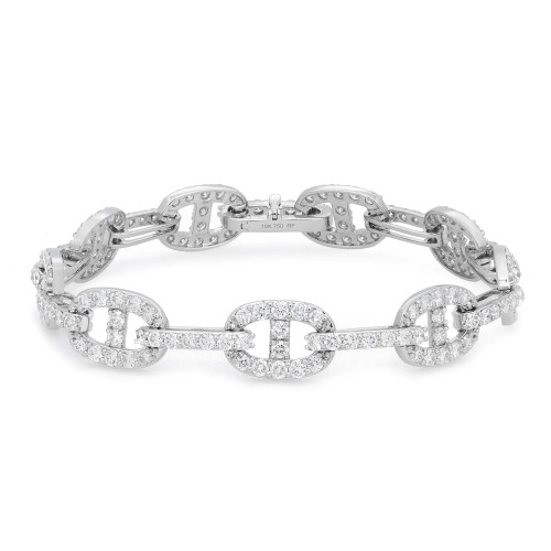 An image of a Rachel Koen women's bracelet with diamonds, displayed on a white background. The bracelet is shown at a slight angle, allowing for a view that captures the shimmer of the round cut diamonds encrusted on its oval and circular white gold links. The bracelet extends diagonally across the frame from the bottom left to the upper right corner, with a close-up view that highlights the intricate detailing and craftsmanship. The clasp and hallmark '18K 750' are visible on the underside of one of the links, indicating the purity of the gold used.
