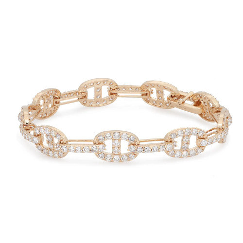An image of a Rachel Koen women's bracelet with diamonds, displayed at a slight angle to show the intricate details and craftsmanship. The bracelet features a series of yellow gold links, encrusted with sparkling round cut diamonds, arranged in an alternating pattern to create a harmonious design. The view is from above, at a close distance, providing a clear view of the bracelet's top surface and its shimmering stones. The background is a neutral white, ensuring the focus remains on the bracelet's elegance.