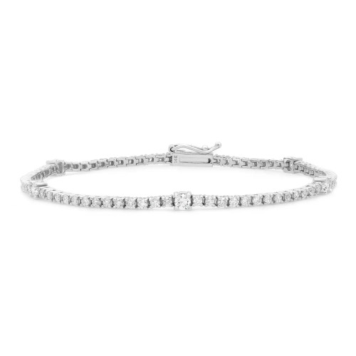 An image of a Rachel Koen women's bracelet with diamonds, displayed in a straight line from left to right across the center of the frame. The bracelet features a series of closely set, round-cut diamonds encased in a white gold metal, with a secure clasp visible on the left side. The piece is photographed from a top view at a medium distance, providing a clear view of the stones and the craftsmanship. The background is white, emphasizing the bracelet's design and sparkle.