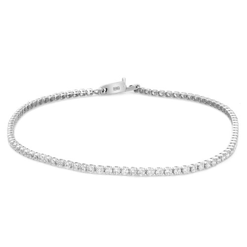 An image of a Rachel Koen unisex adult tennis bracelet with diamonds, displayed against a white background. The bracelet is positioned centrally in the frame, shown in full view with a slight angle to reveal the diamonds' facets. It's a close-up shot, providing a clear view of the individual prong set round cut diamonds and the clasp mechanism, which is partially visible and engraved with the brand name in white gold. The diamonds are set in a symmetrical pattern along the entire length of the bracelet, which is laid out in a slight curve to mimic how it would naturally rest on a wrist.