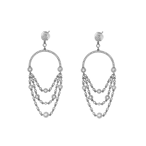 An image of a pair of Messika women's Joy diamond chandelier earrings, displayed frontally and centered. The earrings are chandelier style with cascading chains of diamonds forming three draped loops attached to a diamond-encrusted hoop. The design includes a stud at the top with a halo of smaller diamonds. The background is white, highlighting the sparkle and intricate details of the earrings.