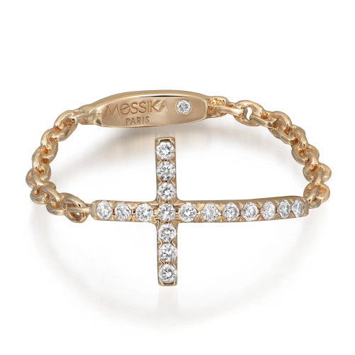 An image of a Messika women's Croix Sur Chaine ring with diamonds, positioned centrally and up-close. The ring features a unique design with a polished yellow gold band inscribed with 'Messika Paris' and interrupted by a cross-shaped setting adorned with sparkling diamonds. The photo captures the ring at a slight angle, highlighting the shine and intricacy of the diamonds and the elegant craftsmanship of the band.