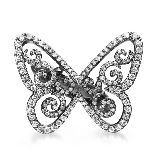 An image of a Messika brand Butterfly Arabesque Diamond 18k blackened white gold ring designed for women.. The ring is displayed head-on at a neutral angle with a close-up view, showcasing its intricate details and sparkling diamonds set along the curves of the butterfly's wings. The background is solid white, emphasizing the ring's design and brilliance.