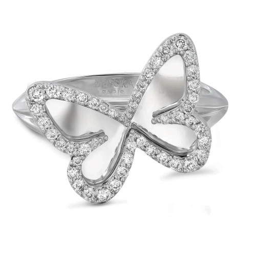 An image of a luxurious Messika women's Plaque Butterfly 18k white gold ring with diamonds, presented at a slight angle and centered in the frame. The band is visible in the background while the intricate, bow-shaped design adorned with sparkling diamonds is in sharp focus in the foreground, showcasing the detailed craftsmanship and the reflective quality of the gems and metal.