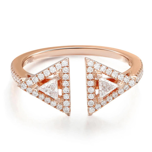 An image of a women's Messika brand Thea 18k rose gold ring with diamonds, shown in a close-up front view. The ring is crafted in rose gold and features a unique split design with two large triangular settings facing outwards. Each triangle is filled with multiple sparkling diamonds of varying sizes, with larger stones set at the angles and smaller pavé diamonds filling the space between. The band of the ring is smooth with a slight curve, and the engraving of the brand name is visible on the lower right side. The image is taken from a distance that clearly displays the intricate details of the diamonds and the overall design of the ring.