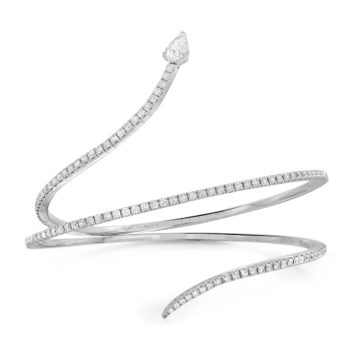 An image of a luxurious Messika women's Snake Skinny 2 band wrap 18 k white gold bracelet with diamonds, showcased on a white background. The bracelet has an elegant spiral design with a large, pear-shaped diamond at one end. The piece is photographed from a top-down angle that provides a clear view of the sparkling diamonds encrusted along the entire length of the bracelet. The bracelet is positioned centrally and fills the frame, suggesting a close-up view that highlights the intricate details and craftsmanship.