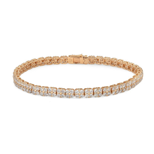 An image of a Rachel Koen women's tennis bracelet with diamonds, displayed against a white background. The bracelet is shown in a straight line from a top-down view, allowing the entire length of the piece to be visible. It is positioned horizontally across the frame, with the clasp located slightly to the right of the center. The round cut diamonds are set in a symmetrical pattern, reflecting light and showcasing their brilliance. The yellow gold metal of the bracelet contrasts with the sparkling diamonds, and the distance from the camera provides a clear and detailed view of the entire bracelet.