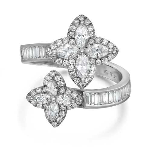 An image of a Rachel Koen women's cocktail ring with diamonds, featuring a close-up view on a white background. The ring displays two prominent flower-shaped settings adorned with multiple sparkling diamonds of varying sizes. Each flower has four marquise-cut diamonds as petals surrounded by a halo of smaller round diamonds in white gold. The band is encrusted with a row of baguette-cut diamonds, and it splits elegantly to support each flower. The image is taken from a slightly elevated angle to highlight the intricate design and the reflective facets of the diamonds.