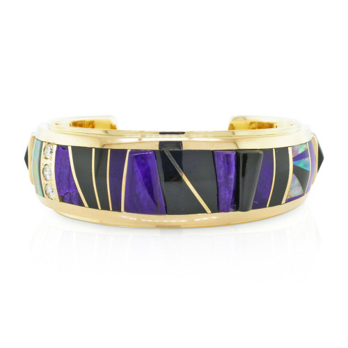 An image of a Black Jade Fire Opal Raoul Sosa women's bracelet with diamonds, positioned centrally and viewed from a front angle at close distance. The bracelet features a 14k yellow gold band with inlaid black jade gemstones and opal fragments separated by thin yellow gold lines, accented with small, sparkling diamonds along one edge. The background is white, highlighting the jewelry's colors and shine.