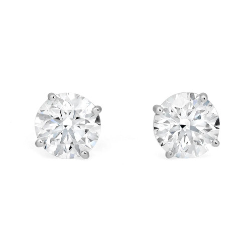 An image of a pair of Rachel Koen unisex adult lab grown diamond stud earrings, displayed frontally at a close range. Each earring features a large, round-cut diamond securely held in place by four prongs in white gold, with a white background that accentuates their brilliance.