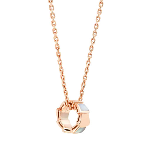 An image of a Bvlgari women's Serpenti Viper necklace with mother of pearl, featuring a circular 18 rose gold pendant with mother of pearls insets, suspended from a matching rose gold chain. The necklace is shown against a white background, centered and viewed from a front angle, with the chain partially visible as it extends towards the top edges of the frame. The condition of necklace is new. 