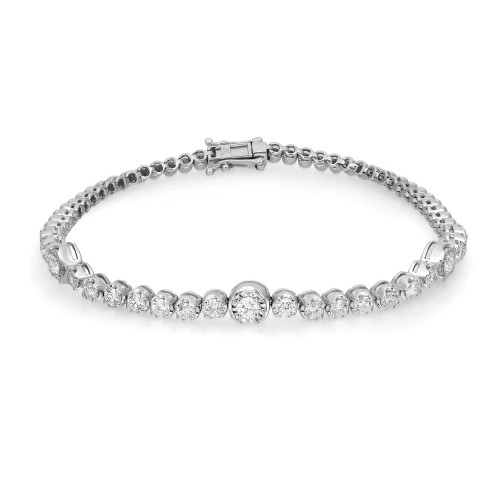 An image of a Rachel Koen women's bracelet with diamonds, displayed in a straight line at a slight angle, allowing a full view of the piece. The bracelet features a series of round-cut diamonds, each set within individual links that create a continuous sparkling white gold band. The image is a close-up, showcasing the intricate details and reflective quality of the diamonds and silver-tone metal, with the clasp visible on the left side. The background is white, emphasizing the bracelet's elegance and craftsmanship.