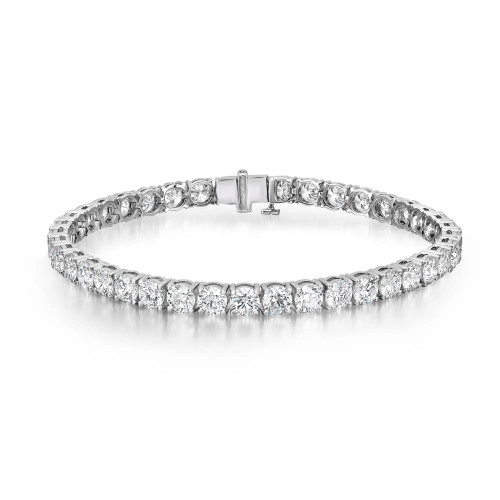 An image of a unisex adult tennis bracelet by Rachel Koen, featuring a single row of uniformly sized, round-cut lab grown diamonds set in white gold. The bracelet is positioned horizontally in the center of the frame, displayed against a white background. It is viewed from a top-down angle, providing a clear view of the sparkling diamonds and the secure clasp mechanism. The image is taken from a close distance, focusing on the intricate details of the diamonds and the craftsmanship of the setting.