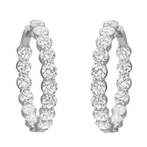 An image of a pair of Rachel Koen women's hoop earrings with lab grown diamonds, shown frontally at an equal distance from the viewer. The earrings feature a series of large, round-cut diamonds set in prong setting in a straight line on a white gold hoop structure, creating a luxurious and sparkling appearance. The earrings are positioned parallel to each other, with light reflecting off the facets of the diamonds to emphasize their clarity and brilliance.