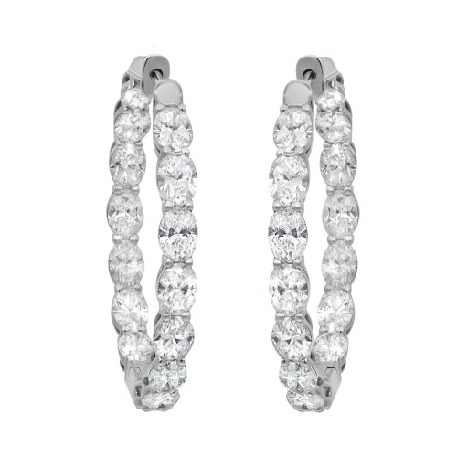 An image of a pair of Rachel Koen women's earrings with lab grown diamonds, presented in a frontal view on a neutral background. The earrings feature a vertical row of large, round-cut diamonds set in inside out in prong setting in a white gold material. Each earring is shown from a straight-on angle, with both positioned symmetrically and occupying a central position in the frame, providing a clear view of their design and luxurious stones. They are displayed at a medium distance, allowing for the intricate details and the sparkle of the diamonds to be appreciated.