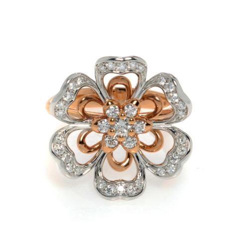 An image of a Luca Carati brand women's cocktail ring with diamonds, showcasing a close-up front view on a white background. The ring features a flower design with petals alternating in polished rose and white gold, embellished with pavé-set diamonds. The center of the flower is highlighted with larger, prong-set diamonds, giving a three-dimensional appearance. The angle of the photo captures the reflective surfaces and brilliance of the diamonds, emphasizing the intricate details and craftsmanship of the ring.