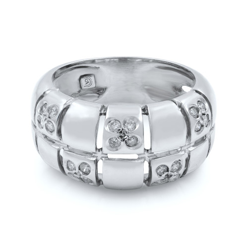 An image of a women's Rachel Koen brand cocktail ring with diamonds, showcased in a close-up frontal view on a white background. The ring features a robust, shiny white gold band adorned with multiple inset diamonds. Some diamonds are grouped in clusters, while others are spaced evenly along the band, creating a pattern of brilliance and texture. The photograph is taken from a slight angle above the ring, focusing on the details and craftsmanship of the piece.