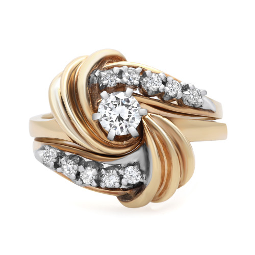 An image of a Rachel Koen women's engagement ring with diamonds, showcased from a top view angle. The ring features a unique multi-band design with intertwined yellow gold bands, displaying a mix of polished and textured finishes. A large, prominent diamond is centrally set, surrounded by smaller diamonds embedded within the swirls of the bands. The image is taken from a close distance, providing a detailed and clear view of the intricate design and sparkling diamonds.