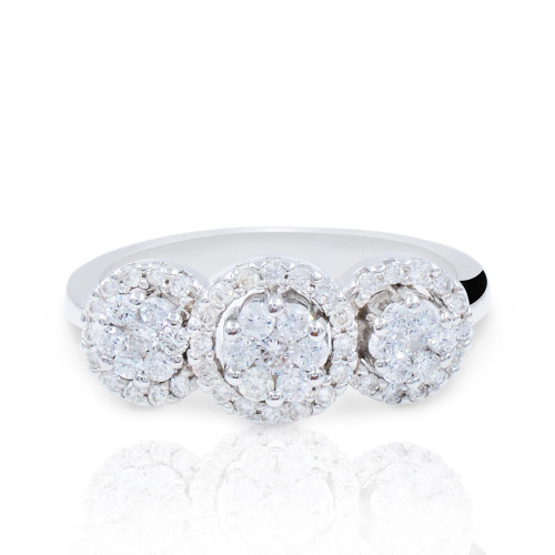 An image of a Rachel Koen brand women's engagement ring with diamonds, presented on a white background. The ring features a frontal view, showcasing three prominent round clusters of small sparkling diamonds set in a white gold band. The band itself is partially visible, curving gently to the left and right at the edges of the frame, and the view is taken from a front-facing angle at a close distance, providing a clear view of the diamonds' cuts and the ring's intricate design. The ring is centered in the image, with a soft reflection visible on the glossy surface beneath it.