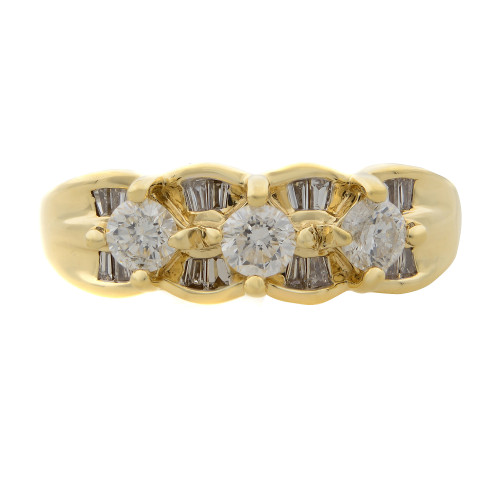 An image of a Rachel Koen brand women's ring with diamonds, displayed in a frontal view showcasing the entire band. The ring features a series of round and baguette-cut diamonds set in a polished yellow gold band, with the diamonds arranged in an alternating pattern. The image is taken from a close, direct angle, providing a clear view of the ring's intricate design and the sparkle of the diamonds.