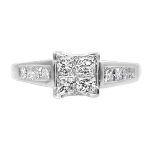 An image of a Rachel Koen women's engagement ring with diamonds, showcased in a close-up, front view. The ring features a prominent square cluster of four sparkling princess cut diamonds at its center, flanked by channel-set princess cut diamonds on the band, all set in a polished white gold metal. The image is taken from a top-down angle, providing a clear view of the ring's design and the cut of the diamonds.The ring is pre owned in a great condition.