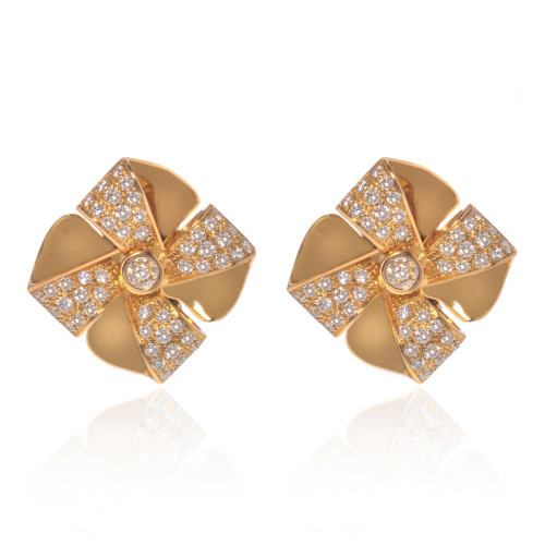 An image of a pair of Luca Carati women's earrings with diamonds, shown in a front-facing view against a white background. The earrings are designed with a pinwheel-like pattern in polished yellow gold, each segment pavé-set with sparkling round diamonds and a larger diamond centered on each earring. They are positioned symmetrically with a slight distance between them, giving a clear view of their intricate design and luxurious finish. The angle provides a direct look at the earrings’ details and craftsmanship.