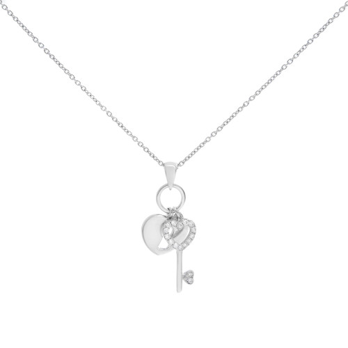 An image of a Piero Milano women's pendant necklace with diamonds, displayed against a white background. The necklace features a delicate white gold chain with a pendant consisting of two charms: a solid heart and a key with a heart-shaped top encrusted with diamonds. The key's shaft also has a single diamond at its end. The image is taken from a front-facing angle at a close distance, showing the necklace centered and in focus, providing a clear view of the intricate details and reflective surfaces.