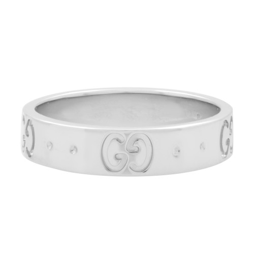 An image of a women's Gucci icon GG ring without stones, shown in a close-up frontal view centered in the frame. The ring features the iconic interlocking "GG" logo embossed at regular intervals around its white gold band, displayed against a white background. The angle of the photograph is direct, with the ring's band running horizontally across the field of view, providing a clear and unobstructed look at the design details.The ring is pre owned in a great condition. 
