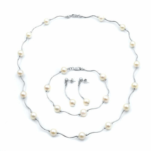 An image of a Rachel Koen women's pearl jewelry set necklace bracelet and earrings, displayed on a white background in a flat, overhead view. The necklace features evenly spaced pearls along a delicate white gold chain, with a matching bracelet and earrings set placed below it, all arranged in a symmetrical fashion with the necklace's clasp visible at the top center.