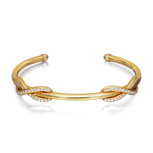 An image of a Tiffany & Co cuff bracelet designed for women, featuring a sleek 18k yellow gold band adorned with round brilliant cut diamonds. The bracelet is positioned horizontally at a slight angle, showcasing the intricate diamond-studded loops near the center. The image is taken from a close-up perspective, highlighting the luxurious details and craftsmanship. Excellent pre-owned condition. 