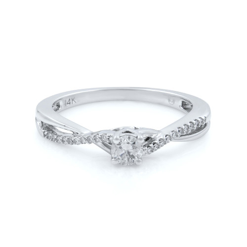 An image of a women's Rachel Koen engagement ring with diamonds, viewed from a slightly elevated angle and positioned centrally. The ring features a central round diamond held by prongs, with smaller diamonds lining the band in a white gold elegant twist design. The image is captured at a close distance, highlighting the intricate details and the 14K marking inside the band.