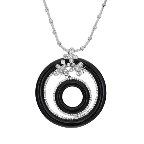 An image of a Rachel Koen women's necklace featuring a pendant with concentric circular designs. The outer and inner circles are black, while the middle circle is embellished with diamonds. Above the circles, diamond-studded floral motifs add elegance. The necklace is viewed from the front, centered, and at a close distance, showcasing its intricate details.
