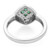 An image of a Rachel Koen women's ring featuring diamonds and emerald. The ring is shot from a top-down angle, centered and up close from the back, showcasing the unique teardrop-shaped setting with small green gemstones arranged in a grid pattern, surrounded by a halo of tiny diamonds. The band is polished 14k white gold, and the image is on a white background. The condition of the ring is pre owned. 