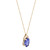 Left view of the necklace showing the side view of the pendant mounting holding the tanzanite stone and diamonds with yellow gold link chain