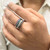 Front view of the four band ring studded with diamonds and gemstones on a model hand showing the proper ring fit on the finger