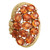 Front view of the cocktail ring showing the prong set oval-shaped golden orange spessartite with round cut diamonds in an oval-shaped pattern outlined in textured yellow gold.
