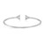 An image of a Messika women's bracelet positioned centrally and from the back displayed against a white background. The bracelet is captured from a top view at a close distance, showcasing its elegant design. The bracelet is open-ended with two triangular motifs. 