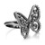 An image of a women's Messika brand ring featuring a butterfly design encrusted with diamonds. The ring is positioned at a slight angle to show the intricacies of the butterfly motif, which is placed at the center and occupies the majority of the frame. The band of the ring curves smoothly into the butterfly, and the diamonds catch the light, giving a sparkling effect. The shot is a close-up, highlighting the details of the design and craftsmanship.