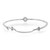 An image of a women's Messika bracelet with diamonds, positioned centrally and displayed in high resolution. The bracelet is shown from a top-down angle with a slight tilt, allowing a clear view of the diamond centerpiece and the surrounding smaller diamonds set in a delicate, slender band. A small chain adjustment detail with the brand name is visible on the right side, and the entire piece is captured at a close distance to showcase the intricate design and sparkling gems on a white background.