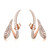 An image of a pair of Messika brand earrings designed for women, featuring a curved design encrusted with multiple small diamonds. The earrings are presented in a symmetrical view, positioned vertically side by side, with the left earring slightly overlapping the right at the bottom. They are set against a white background, and the camera angle is head-on, capturing the earrings in great detail from a close distance, showcasing the sparkle and intricate setting of the diamonds on the rose gold base.