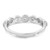 An image of a Messika brand women's ring with diamonds, displayed at a slight angle to showcase the intricate design and diamond placement. The band is polished white gold with a scalloped edge and several small, round diamonds set equidistant along the top half. The ring is centered and occupies the middle ground of the image, providing a clear view of its craftsmanship. The background is a neutral white, emphasizing the ring's details and reflective qualities.