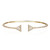 An image of a women's Messika Skinny Thea Diamond open 18k yellow gold bracelet with diamonds, presented on a white background. The bracelet is shown in a frontal view with a slight angle, highlighting its open cuff design and triangular diamond-encrusted details at each end. It is positioned centrally in the frame, allowing a clear view of the piece from a medium distance. The bracelet's band is slim and encrusted with smaller diamonds, complementing the two larger, triangle-shaped features. 