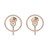 An image of a pair of women's Messika brand Glam'Azone stud 18k yellow gold earrings with diamonds, presented against a white background. The earrings feature a circular design with a central diamond, surrounded by smaller diamonds set in a halo pattern. The circles are attached to a diamond-encrusted bar that acts as the drop element of the earring. The earrings are positioned symmetrically, facing forward, with a medium-close perspective that provides a clear view of the intricate details and the reflective quality of the gold and diamonds.