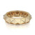 An image of a luxurious Messika women's ring with diamonds, displayed in a close-up view against a white background. The ring features a bold, geometric design with a faceted gold band. A row of sparkling diamonds encircles the bottom edge of the ring, adding a touch of elegance. The brand's hallmark and a serial number are clearly visible on the inner surface of the band, indicating authenticity. The ring is positioned at a slight angle, showcasing its unique facets and the brilliance of the diamonds.