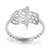 An image of a Messika women's Faith ring with diamonds, showcased at a slight angle to emphasize its unique design. The ring features a series of brilliant round diamonds set along a smooth, polished band that curves gently around the finger. The band is adorned with the Messika brand name, and the ring's upper portion displays a distinctive, cut-out pattern that enhances its elegance. The photo is a close-up, providing a clear view of the ring's intricate details and reflective surfaces.