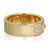 An image of a Messika brand women's Spiky Diamond band ring, showcasing a smooth, polished yellow gold band with a pavé-set diamond section at a tilted angle on the right. The band has a broad, flat surface and the Messika logo is subtly inscribed on the inside. The ring is positioned centrally in the frame with a close-up view to highlight the shine of the gold and the sparkle of the diamonds.