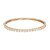 An image of a Rachel Koen women's bangle bracelet with diamonds, presented in a close-up front view on a neutral background. The bracelet displays a row of sparkling emerald cut diamonds set in a yellow  gold bracelet, positioned horizontally across the frame with a slight perspective angle that showcases its circular shape and intricate detailing.