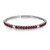 An image of a Rachel Koen women's bracelet with diamonds and ruby gemstones, displayed at a three-quarter angle. The bracelet is in sharp focus against a white background. It features a series of deep red ruby gemstones, surrounded by smaller, sparkling diamonds set in a white gold bangle bracelet. The clasp and hinge are visible, indicating the bracelet is open and its inner markings are partially visible, showing the brand's initials and metal purity. The bracelet is positioned horizontally across the frame, with the gemstones facing slightly towards the left, giving a clear view of its design and craftsmanship from a short distance.